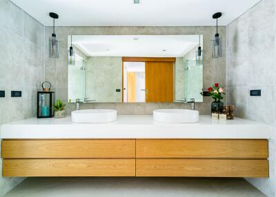 Modern bathroom with double sinks and large mirror