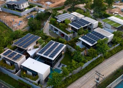 Aerial view of modern homes with solar panels