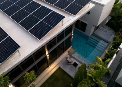 Modern building with solar panels and pool