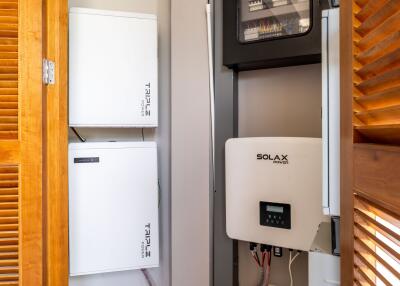 Utility room with solar power and battery systems installed