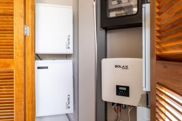 Utility room with solar power and battery systems installed