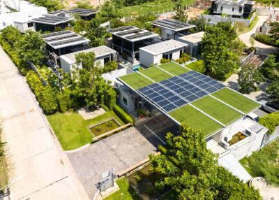 Aerial view of a modern residential complex with solar panels