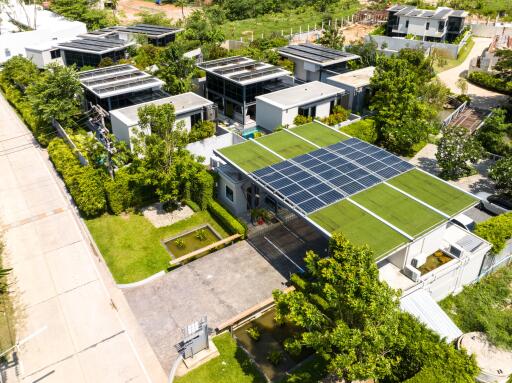 Aerial view of a modern residential complex with solar panels