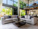 Modern living room with large windows and loft area