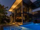 Modern house exterior with pool at night