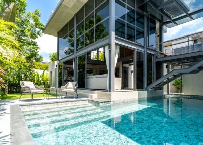 Modern house with outdoor pool and patio