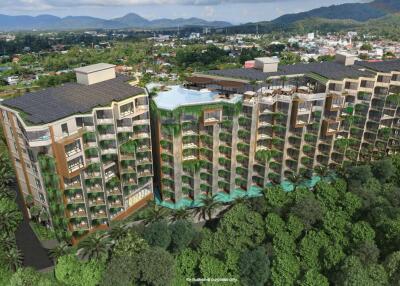 Arial view of a modern residential building surrounded by greenery with a rooftop pool