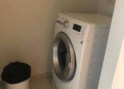 Laundry room with washing machine