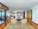 Bright and modern living-dining area with wooden flooring and natural light