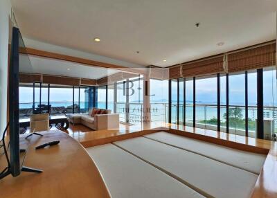 Modern living room with large windows and sea view