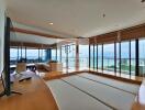 Modern living room with large windows and sea view