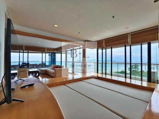 Modern living room with large windows and sea view