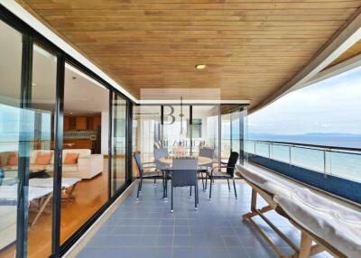 Spacious balcony with ocean view and seating area