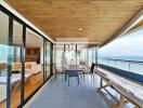 Spacious balcony with ocean view and seating area