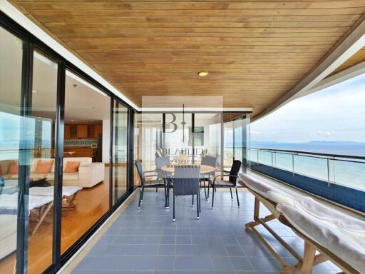 Spacious balcony with ocean view and seating area