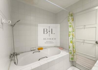 Bathroom with bathtub and shower