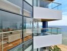 Modern beachfront building with glass balconies