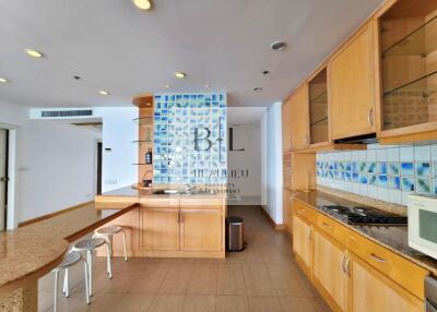 Modern kitchen with wooden cabinets and breakfast island