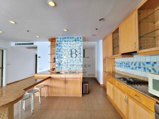 Modern kitchen with wooden cabinets and breakfast island