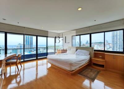 Spacious bedroom with a panoramic view of the city and ocean