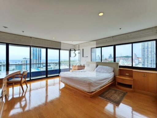 Spacious bedroom with a panoramic view of the city and ocean