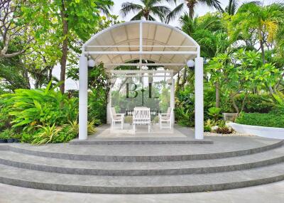 A beautiful gazebo surrounded by lush greenery