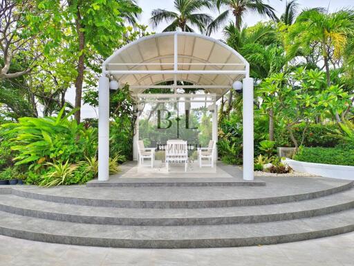 A beautiful gazebo surrounded by lush greenery