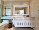 modern bathroom with vanity, toilet, and large mirror