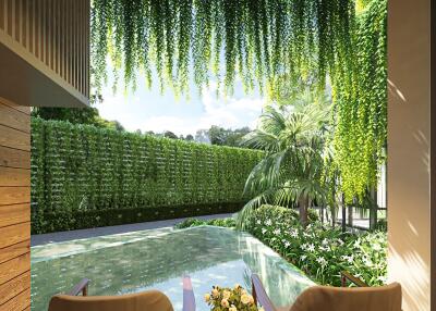 Outdoor seating area overlooking a pool and greenery