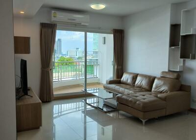 Modern living room with large window and city view