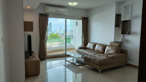 Modern living room with large window and city view