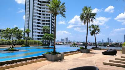 Outdoor pool area with views of city buildings