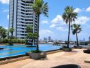 Outdoor pool area with views of city buildings