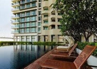 Apartment building exterior with poolside view