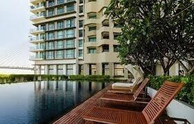 Apartment building exterior with poolside view