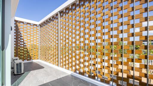 Spacious balcony with wooden lattice