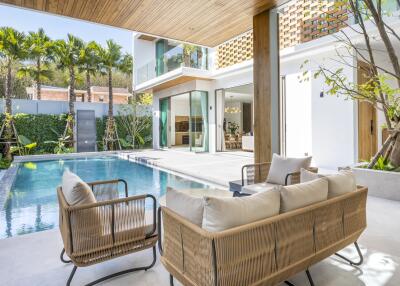 Modern outdoor seating area with pool view