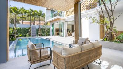 Modern outdoor seating area with pool view