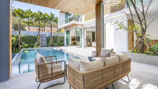 Modern outdoor seating area with pool view