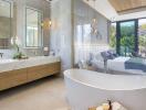 Modern bathroom with freestanding tub and view to bedroom