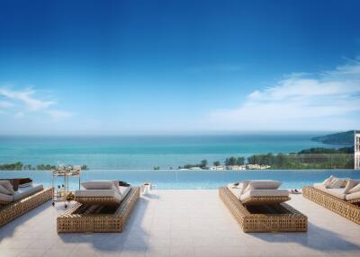 Luxury outdoor terrace with ocean view and lounge chairs