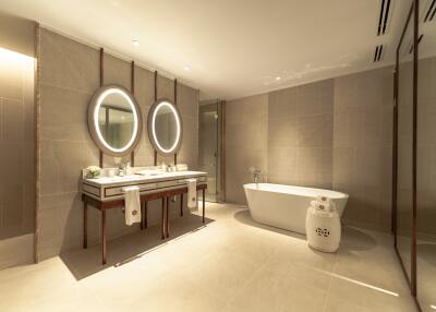 Modern bathroom with double vanity and freestanding tub