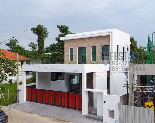 Modern two-story house with carport