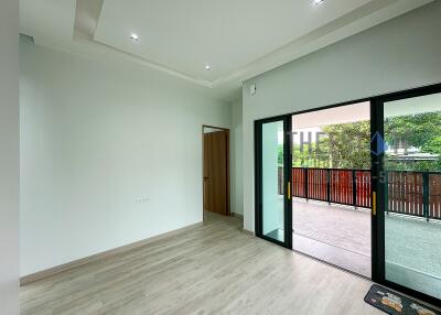 modern living room with large sliding glass doors opening to a balcony