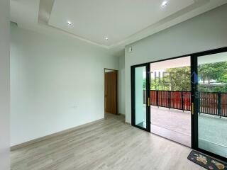 modern living room with large sliding glass doors opening to a balcony