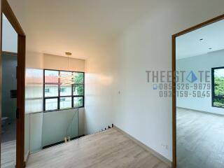 Modern interior with hallway and large window