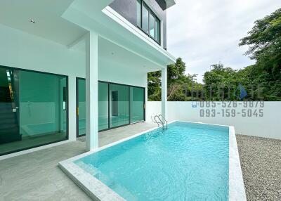 Outdoor area with swimming pool and modern house