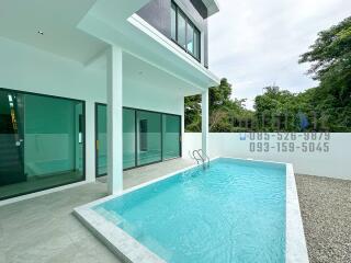 Outdoor area with swimming pool and modern house