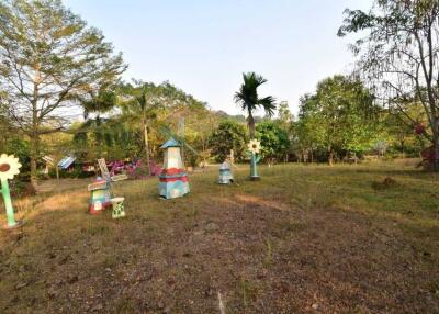 Spacious garden with decorative structures and lush greenery