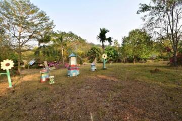 Spacious garden with decorative structures and lush greenery